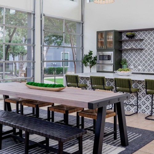 clubroom with kitchen and seating 