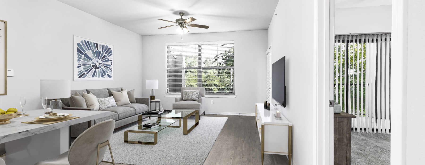 Light and bright living area with a couch and tv